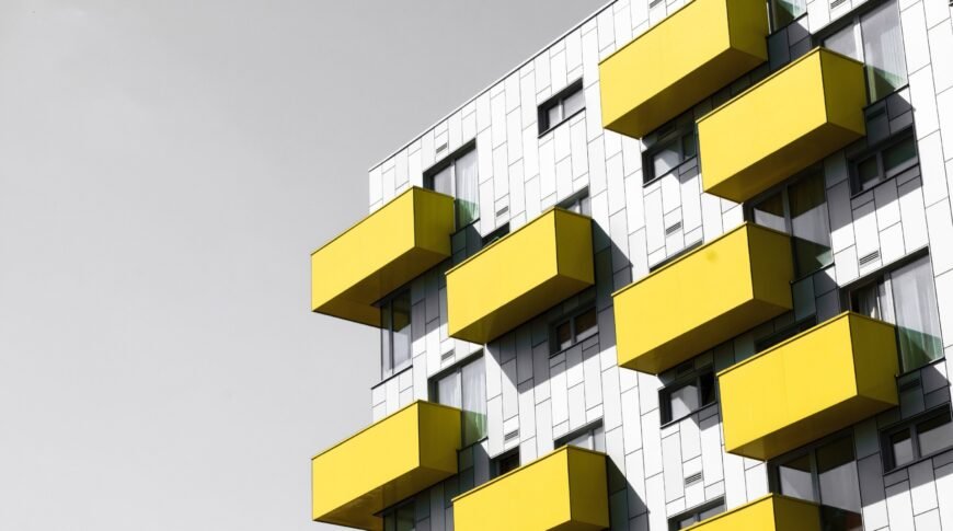 Modern apartments Modern apartments with balconies set against a blue sky